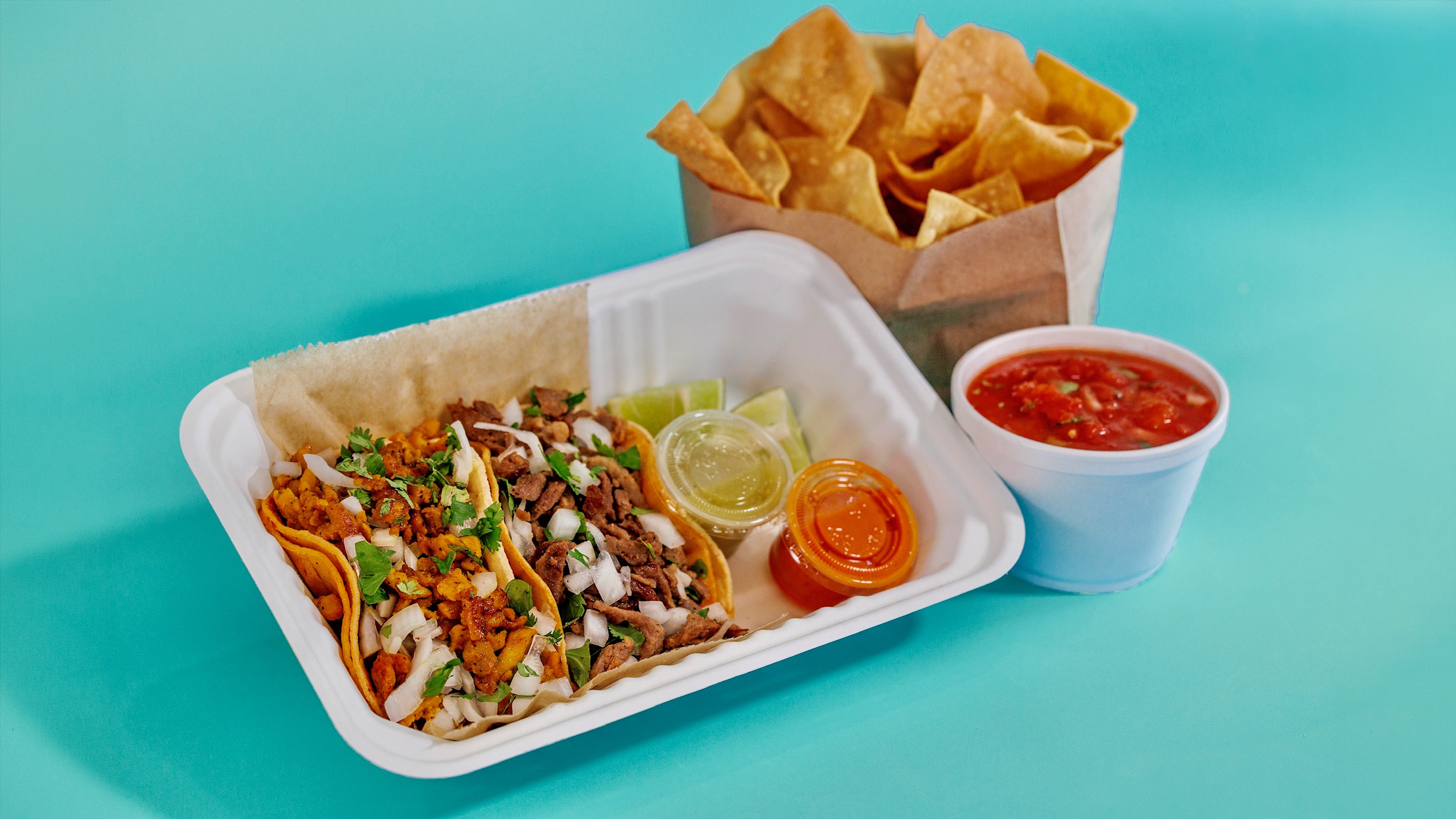 Pronto Combo with tacos, chips, salsa, and sauces