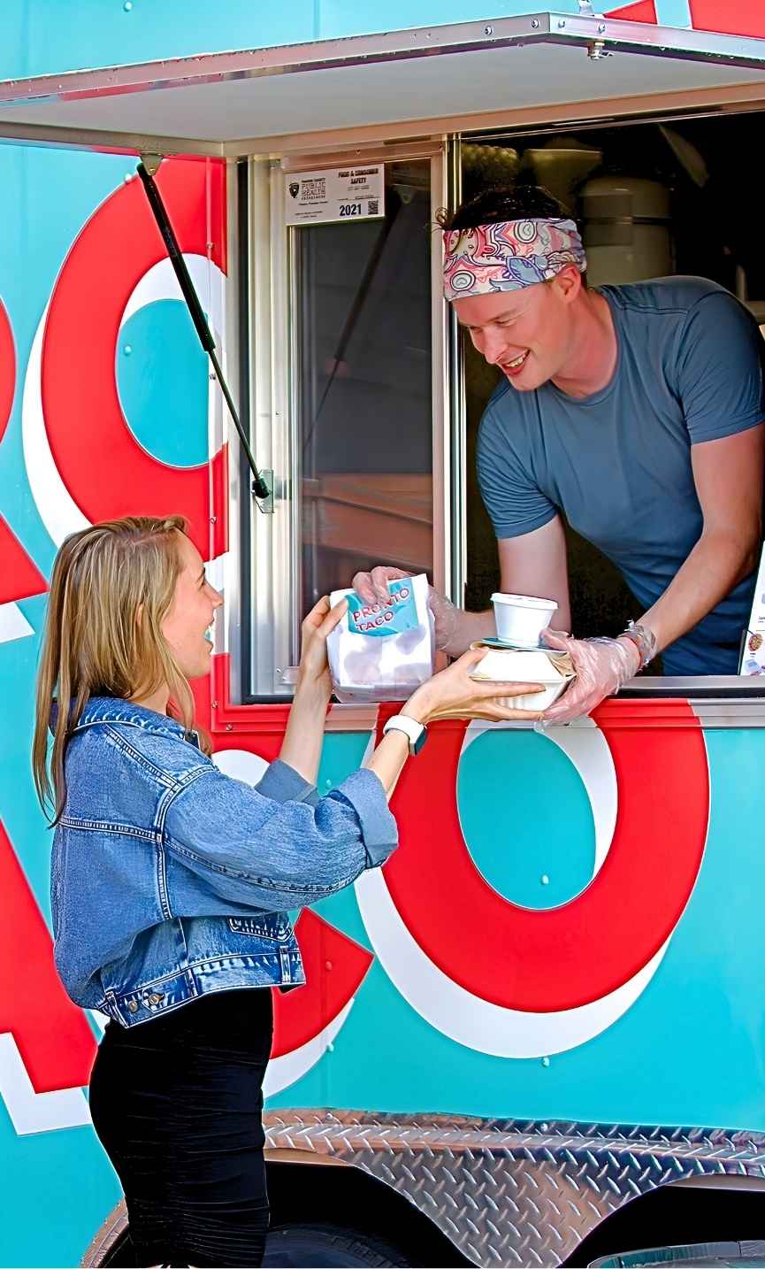 Pronto Taco food truck serving tacos hot off the grill at an Indianapolis event