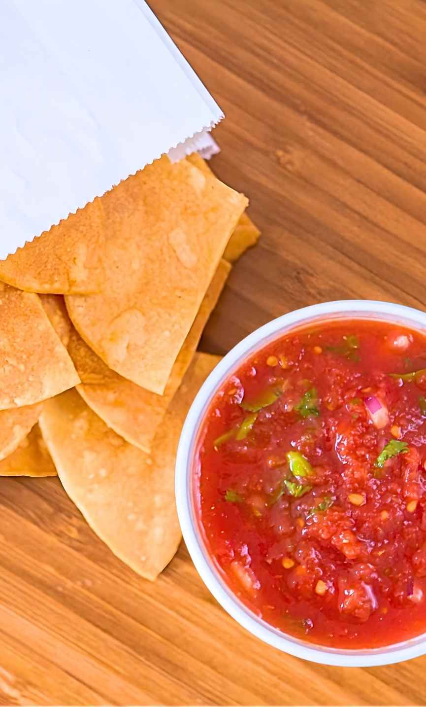 Chips and queso dip packed for carryout at Pronto Taco in Beech Grove, Indiana