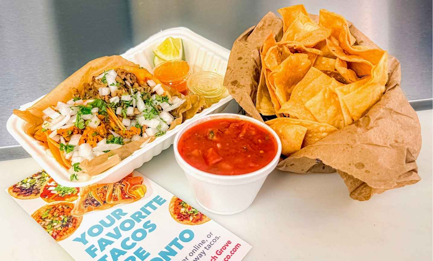 Pronto Combo with two tacos, chips, and salsa ready to serve