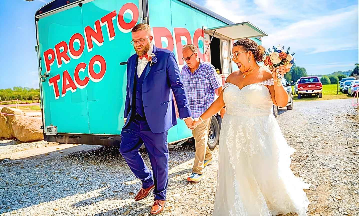 Guests enjoying tacos at a wedding reception