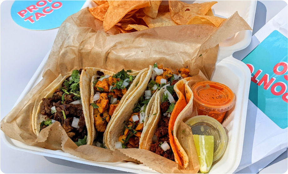 Closeup of a taco box with four tacos